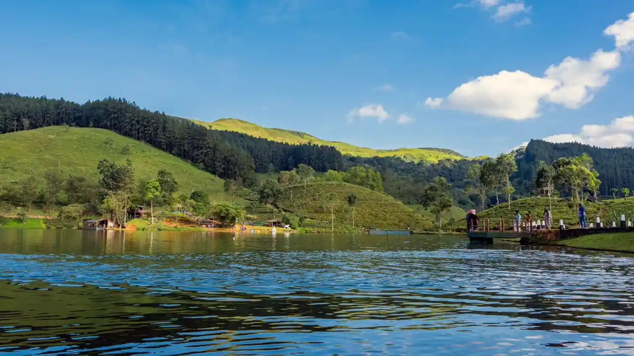 Sembuwatta Lake surrounded by lush mountains in Sri Lanka