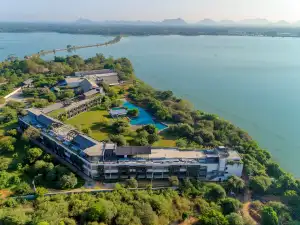 DoubleTree by Hilton Weerawila Rajawarna Resort pool by the lake near Yala National Park, Sri Lanka