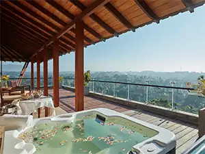 Luxury honeymoon room at Earl's Regency Hotel in Kandy, set up with rose petals and champagne